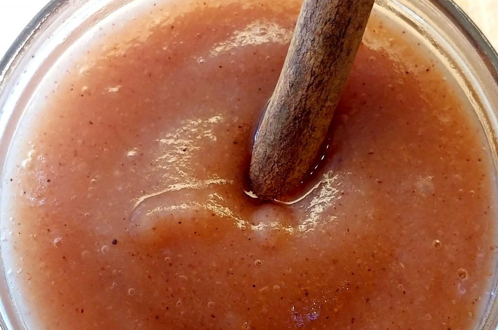 Up close pear sauce with cinnamon stick